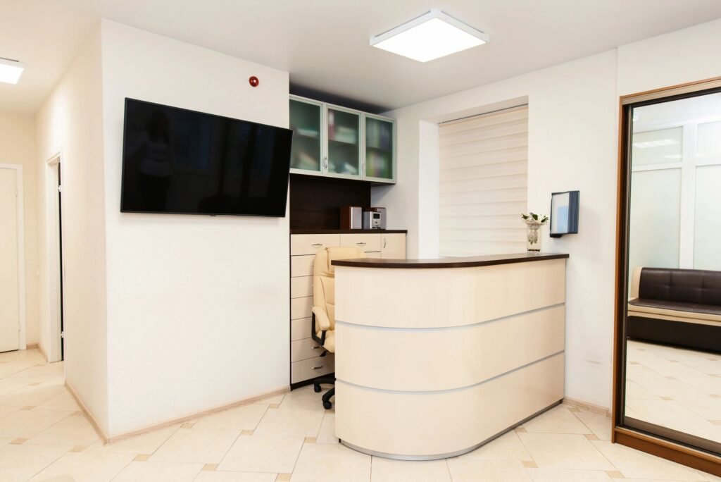 Wide shot interior of modern dental clinic with reception desk
